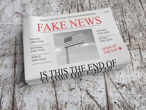 A newspaper saying "Fake news" in the headline